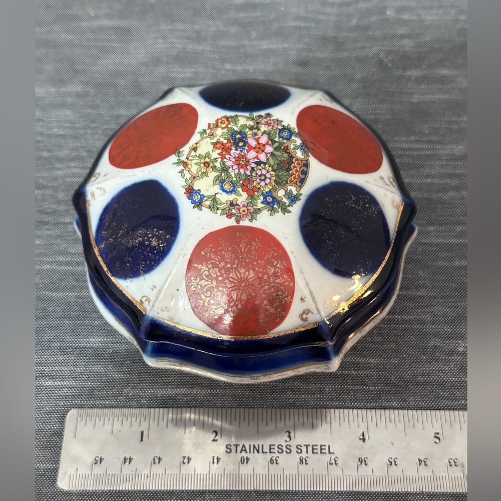 Antique white porcelain tinket box with lid hand painted gold leaf.Queen Ann leg